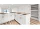 Modern kitchen with white cabinets, granite countertops and pantry at 3807 S Atlantic Ave # 2020, Daytona Beach, FL 32118