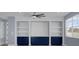 Stylish built-in shelving and cabinetry in a bonus room at 3814 Golden Feather Way, Kissimmee, FL 34746