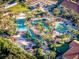 Aerial view of sprawling resort-style pool complex with water features at 408 Miramar Avenue, Davenport, FL 33897