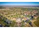 Aerial view of community with resort-style pool, and numerous residential buildings at 408 Miramar Avenue, Davenport, FL 33897