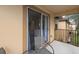 Private balcony with seating area, overlooking a courtyard at 408 Miramar Avenue, Davenport, FL 33897