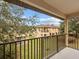 Private balcony overlooking the community with green space and other townhouses at 408 Miramar Avenue, Davenport, FL 33897