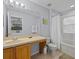 Bathroom with tub, toilet and double vanity at 408 Miramar Avenue, Davenport, FL 33897