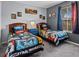 Bedroom with two twin beds and Star Wars themed bedding at 408 Miramar Avenue, Davenport, FL 33897