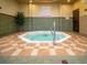 Community hot tub with tiled surround at 408 Miramar Avenue, Davenport, FL 33897