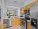 Kitchen with stainless steel appliances and breakfast bar at 408 Miramar Avenue, Davenport, FL 33897