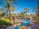 Relaxing pool area with a waterslide and palm trees at 408 Miramar Avenue, Davenport, FL 33897