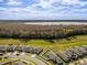 Aerial view of lake and houses at 4085 Sandhill Pl, Leesburg, FL 34748