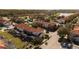 Aerial perspective of townhouses, showcasing their layout and landscaping at 4571 Ada Ln, Kissimmee, FL 34746