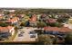 Aerial view highlighting townhouses, parking, and surrounding neighborhood at 4571 Ada Ln, Kissimmee, FL 34746