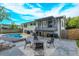Spacious backyard with firepit, patio, and pool at 664 Little Wekiva Rd, Altamonte Springs, FL 32714