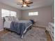 Spacious main bedroom with plush bedding and a desk area at 664 Little Wekiva Rd, Altamonte Springs, FL 32714