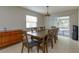 Dining area with large table, six chairs, and access to a screened patio at 664 Little Wekiva Rd, Altamonte Springs, FL 32714