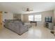 Spacious living room featuring a sectional sofa and tile flooring at 664 Little Wekiva Rd, Altamonte Springs, FL 32714