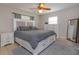 Large bedroom with plush carpet and plenty of natural light at 664 Little Wekiva Rd, Altamonte Springs, FL 32714