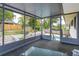 Covered screened porch overlooking the backyard and pool at 664 Little Wekiva Rd, Altamonte Springs, FL 32714