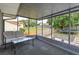 Relaxing screened porch with seating and backyard view at 664 Little Wekiva Rd, Altamonte Springs, FL 32714