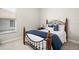 Bedroom with a full-size bed and window at 6702 Huntington Hills Blvd, Lakeland, FL 33810