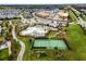 Aerial view of community with resort-style pool and tennis court at 12037 Imaginary Way, Orlando, FL 32832