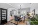 Formal dining room with dark wood table and hardwood floors at 10760 Emerald Chase Dr, Orlando, FL 32836