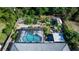 Aerial view of home showcasing a screened pool, patio, and fenced backyard with lush landscaping at 1269 Buccaneer Ave, Deltona, FL 32725