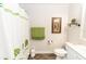 Clean bathroom with shower, toilet, and decorative accents at 1269 Buccaneer Ave, Deltona, FL 32725