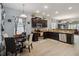 Eat-in kitchen with dark cabinetry, granite counters, and a light-blue color scheme at 15523 Camp Dubois Cres, Winter Garden, FL 34787