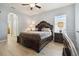 Bright main bedroom with a king-size bed and en-suite bathroom at 15523 Camp Dubois Cres, Winter Garden, FL 34787