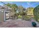 Brick patio leading to a lush, landscaped backyard at 17429 Cobblestone Ln, Clermont, FL 34711