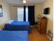 Bright bedroom with two twin beds, dresser, and large window at 2202 Key West Ct # 632, Kissimmee, FL 34741