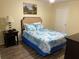 Bright bedroom with a double bed and wood-look flooring at 2202 Key West Ct # 632, Kissimmee, FL 34741