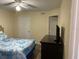 Bedroom with double bed, dresser, and ceiling fan at 2202 Key West Ct # 632, Kissimmee, FL 34741
