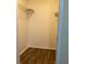 Walk-in closet with wood-look flooring and shelving at 2202 Key West Ct # 632, Kissimmee, FL 34741