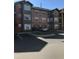 Exterior view of a three-story residential building with parking at 2202 Key West Ct # 632, Kissimmee, FL 34741