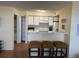 Kitchen features a breakfast bar and white cabinets at 2202 Key West Ct # 632, Kissimmee, FL 34741