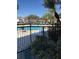 Inviting community pool with surrounding patio and lush landscaping at 2202 Key West Ct # 632, Kissimmee, FL 34741