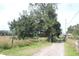 Long gravel driveway leading to property entrance at 3555 E Johnson Ave, Haines City, FL 33844