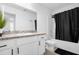 Clean bathroom with white cabinets and bathtub shower at 397 Madison Dr, Davenport, FL 33837
