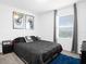 Serene bedroom with king-size bed and abstract art at 397 Madison Dr, Davenport, FL 33837