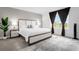 Bright bedroom featuring a king-size bed and natural light at 397 Madison Dr, Davenport, FL 33837