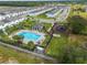 Community pool with a gazebo, lounge chairs, and playground nearby at 397 Madison Dr, Davenport, FL 33837