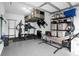 Organized garage with overhead storage, shelving, and fitness equipment at 397 Madison Dr, Davenport, FL 33837