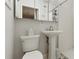 Clean bathroom with pedestal sink and shower at 423 N Main St, Winter Garden, FL 34787