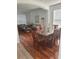 Dining area with hardwood floors and a view into the living room at 4704 Delray Beach Ct, Kissimmee, FL 34746