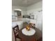 Kitchen with an island, white cabinets, and a breakfast bar at 4704 Delray Beach Ct, Kissimmee, FL 34746