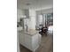 Kitchen with white cabinets, an island, and a breakfast nook at 4704 Delray Beach Ct, Kissimmee, FL 34746