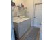 Convenient laundry room with washer, dryer, and shelving at 4704 Delray Beach Ct, Kissimmee, FL 34746