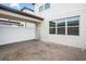 Covered back patio with brick pavers and white fence at 5025 Caspian St, Saint Cloud, FL 34771