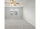 Large bedroom with ceiling fan and carpeted floor at 5025 Caspian St, Saint Cloud, FL 34771