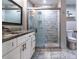 Bathroom with granite vanity, white cabinets, and shower/tub combo at 7270 Westpointe Blvd # 914, Orlando, FL 32835